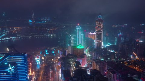 MACAU, CHINA - FEBRUARY 10 2019: night time illumination macau city bay famous hotel rooftop aerial panorama 4k circa february 10 2019 macau, china.