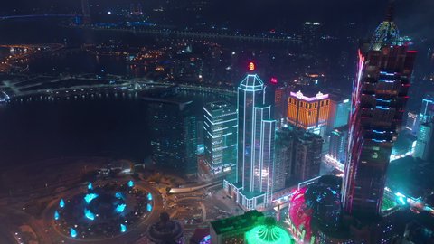 MACAU, CHINA - FEBRUARY 10 2019: night illumination macau city bay famous downtown hotel traffic circle aerial panorama 4k circa february 10 2019 macau, china.