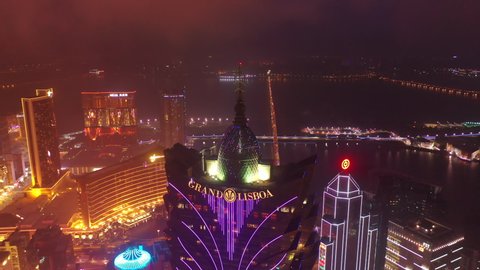 MACAU, CHINA - FEBRUARY 10 2019: night time illumination macau city center famous hotel rooftop aerial panorama 4k circa february 10 2019 macau, china.
