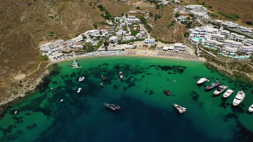 Aerial View of the famous turquoise clear water Psarou Beach with ...