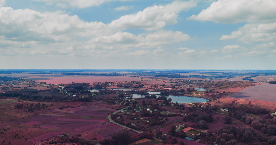drone hyperlapse: clouds fly fast over a winding Amazing  lake and green forests on a sunny summer day in Ukraine - Cityscape Aerial Flight	
