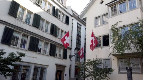 Zurich, Switzerland / Switzerland - 06 12 2019: Zurich, old town, Swiss flags