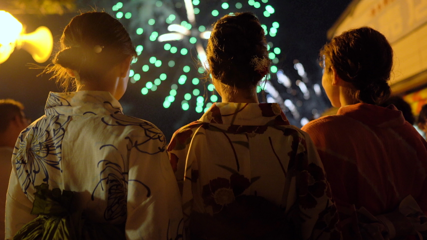 Japanese girls wearing kimono viewing fireworks display during summer holiday in Karatsu, Saga Prefecture Royalty-Free Stock Footage #1033778009