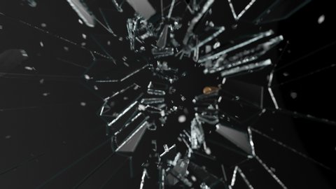 Smooth slow-motion shot of a shiny bullet shattering a clear transparent sheet of glass. Many small pieces of window traveling through the air after the rapid impact. High speed of a round demolish.
