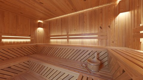 Interior of empty sauna with traditional accessories. Large wooden Finnish sauna, spa room for relaxation and cleansing. Comfortable wooden room lit by warm lights.
