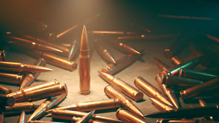 Animation of battleground with a lot of bullets laying on the ground. 360 degrees view around a standing rifle bullet. in a spotlight. Countless amount of deadly ammo. Loopable.
