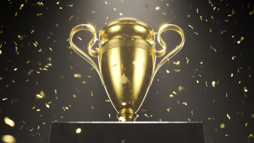 Zoom on champion golden trophy placed on an elevated platform against black background. Shiny award in the spotlight with falling golden confetti. Concept of success, achievement, victory, a prize. 4K
