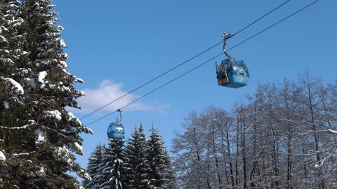 Bansko, Bulgaria - 20 January, 2019: Gondola lift at ski resort in winter in Pirin Mountains. Ropeway station in Bansko