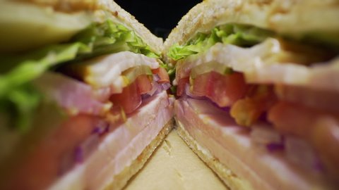 Marco shot inside the sliced club sandwich, camera slides inside the food, macro food, macro layers of cutted sandwich, barrel lense, bug eye view, full hd Prores HQ 422