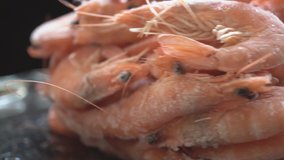 Frozen shrimps rotating.Shrimps. Fresh Prawns close-up. Seafood rotating, preparing healthy food, cooking, diet, nutrition concept. Slow motion.