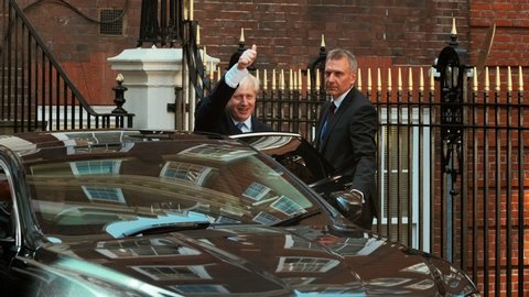 LONDON, circa 2019 - British Prime Minister Boris Johnson salutes the crowds in London, England, UK after becoming British Prime Minister