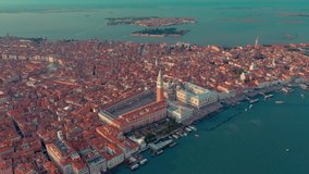 VENICE, ITALY - JUNE, 2019: Aerial drone panorama view of Venice beautiful architecture. Flight over canals and rooftops. Significant tourist sites from above.