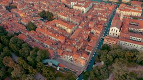 VENICE, ITALY - JUNE, 2019: Aerial drone panorama view of Venice beautiful architecture. Flight over canals and rooftops. Significant tourist sites from above.