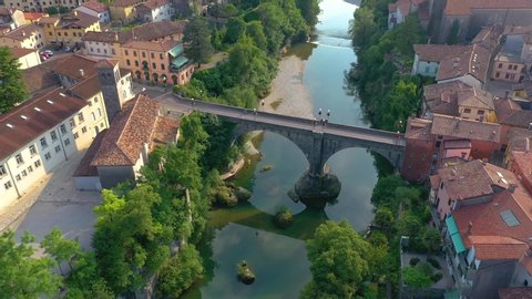 UDINE PROVINCE, ITALY - JUNE, 2019: Aerial panorama drone view of small town Cividale del Friuli historical centre with beautiful architecture. Significant tourist sites from above.