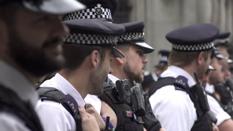 London, United Kingdom (UK) - 07 15 2019: A unit of Metropolitan police officers form a loose cordon