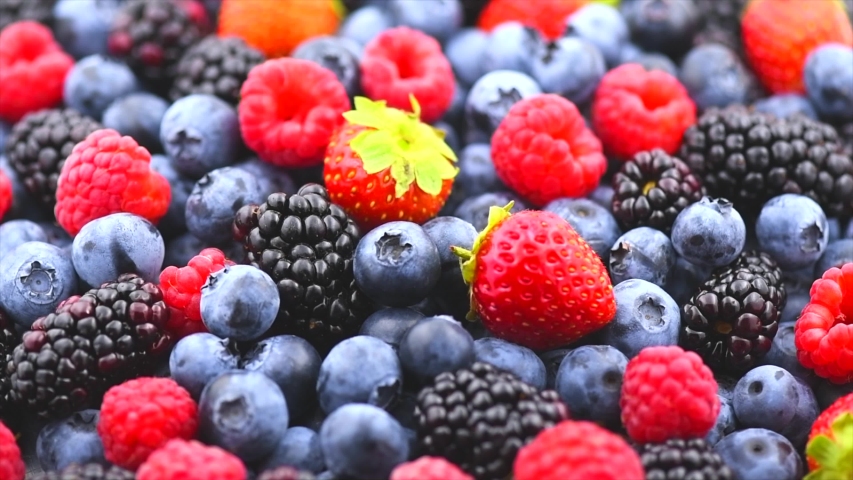 Berries. Various colorful berries rotation background. Mint leaves, Strawberry, Raspberry, Blackberry, Blueberry close-up rotating backdrop. Bio Fruits, Healthy eating, Vegan food, diet. 4K UHD video | Shutterstock HD Video #1033833071