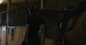 MED TRACKING Caucasian female taking her horse for a ride. Shot on RED Helium. 4K UHD RAW graded footage