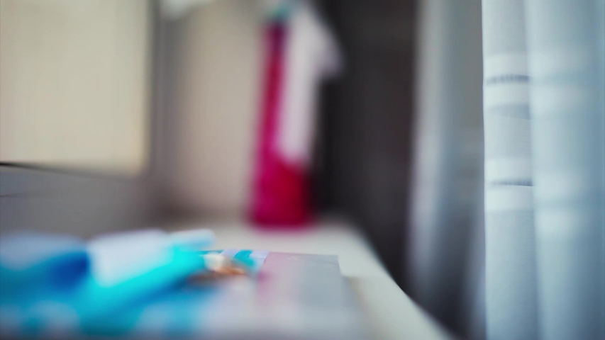 the concept of advertising jewelry, wedding events - two gold rings on a bow of blue ribbon and white sheet