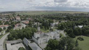 
Hungarian, Brunszvik Castle with Beethoven Memorial Hall and park in Martonvasar, aerial stock video. 
RAW footage for creators to color grade and control the look of your project (dlog, d log).