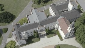 Hungarian, Brunszvik Castle with Beethoven Memorial Hall and park in Martonvasar, aerial stock video. 
RAW footage for creators to color grade and control the look of your project (dlog, d log).