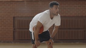 CU Portrait of young confident African American black college basketball player in checking his training results with a sports tracker device. Shot on ARRI Alexa Mini, 4K RAW graded footage