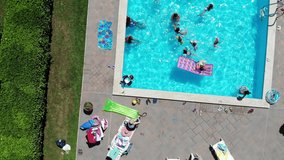 People in the pool arial-swimming pool flight- Pool arial view - Powered by Shutterstock - Get 15% off with code: PIKWIZARD15