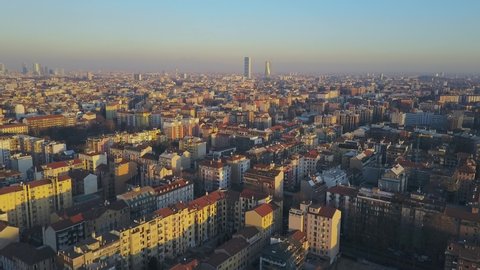 Milan city skyline aerial view at dawn flies backwards. The theatrical performance shot from the Milan cityscape in the fall.
Aerial footage. A short flight that shows the city of Milan skyscrapers 