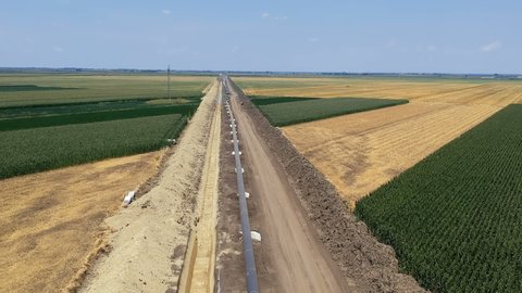 Drone Ascending Above Oil and Gas Pipeline. Pipes are laid on top of supportive sandbags beside the trench,welded together and the weld joints coated with epoxy to prevent corrosion. Turkish Stream.