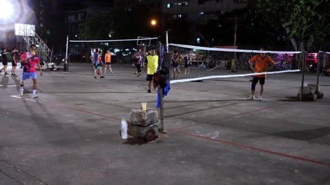 Bangkok, Thailand - May 23, 2019: Thai people playing Sepak Takraw at night in an open recreation complex at Huai Khwang, Bangkok. Sepak Takraw can have 2-4 members in a team. It is popular in Asia. 