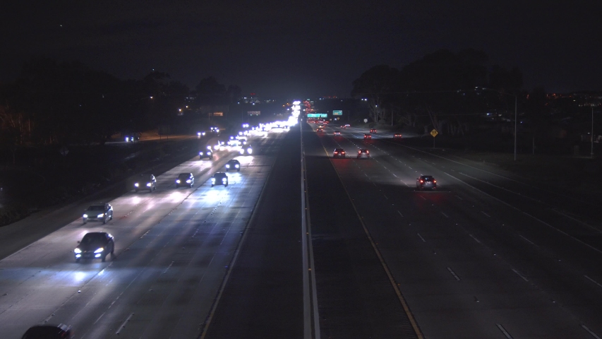 Highway with many cars at night. Heavy traffic | Shutterstock HD Video #1033860116