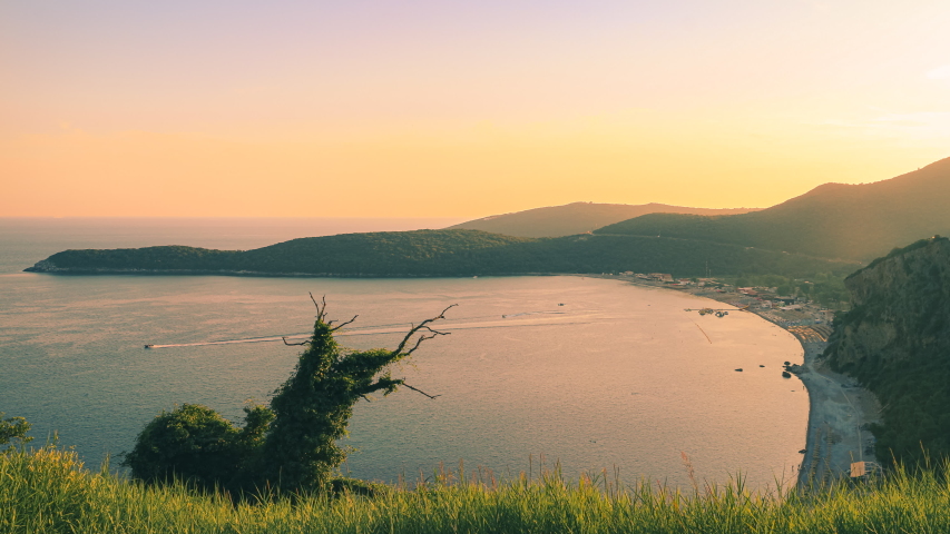 Timelapse Adriatic sea coast with Jaz beach from above at sunset time, Montenegro. 4K time lapse