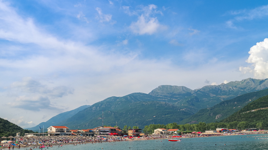 Jaz beach surrounded by mountains on the Adriatic sea coast, Montenegro. 4K time lapse