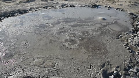 Crater of a gryphon mud volcano in Gobustan, Azerbaijan, with bubbling mud.