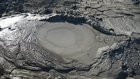Crater of a gryphon mud volcano in Gobustan, Azerbaijan, with bubbling mud.