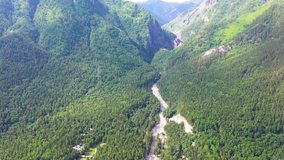 Overview of the beautiful landscape. Flying drone over a mountain river . Bird's eye view