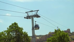 The cable car, the elevator transports people at a height through the mountains and the city. Georgia, Tbilisi. - Powered by Shutterstock - Get 15% off with code: PIKWIZARD15