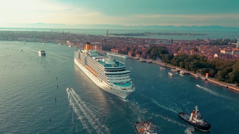 VENICE, ITALY - JUNE, 2019: Aerial drone panorama view of Venice. ?ruise ship sails past historic sites. Significant tourist sites from above.