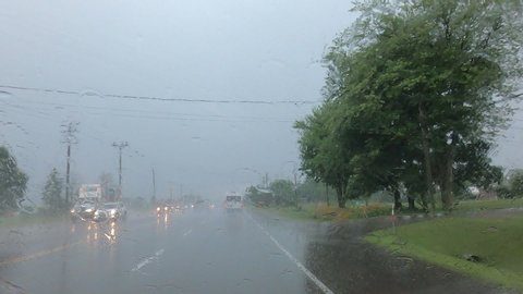 Driving plate POV in heavy rain during thunderstorm 