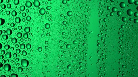 Texture water drops on the green glass - background