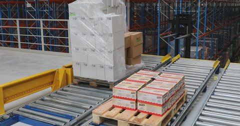 Novi Sad, Serbia - June 02, 2017: Pallet With Boxes at Gravity Conveyor Warehouse in Novi Sad, Serbia.