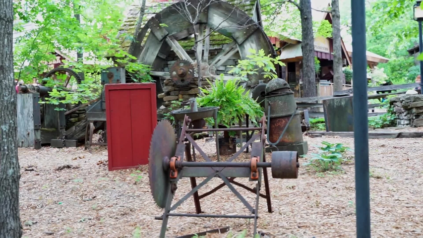 Old water wheel being driven by a small stream of water in the Ozark Mountains