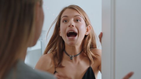 angry teenage girl shouting at mother having serious argument with daughter about messages on smartphone upset teen shuts door emotional stress at home 4k footage
