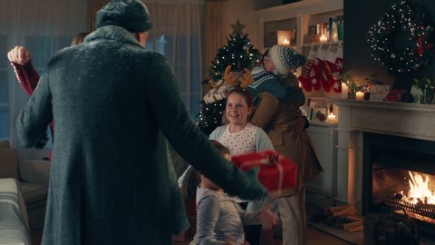 grandparents arriving Christmas eve hugging family enjoying festive holiday celebration on winter evening at home 4k footage – Stockvideo