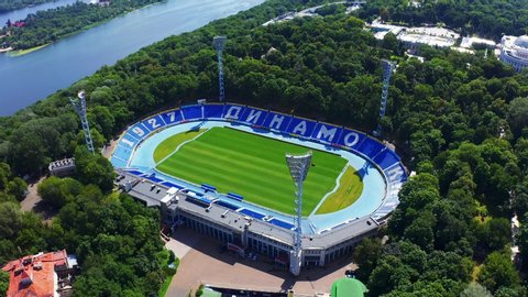Kyiv, Ukraine - June, 2019: Aerial view of Kiev Dynamo stadium in summer. Bank of the Dnieper River nearby 4k