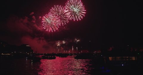 Slow motion of majestic salute in the sky of the redeemer venice Redentore holiday festival fireworks in Venice Italy with offshore yachts.