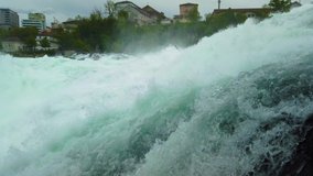 4K Close up video shot of water. Rheinfall waterfall on Rhein (Rhine) river in Switzerland. It is the largest waterfall in Europe with massive water power.