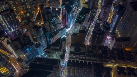 night illumination flight over hong kong city downtown traffic aerial topdown panorama 4k timelapse