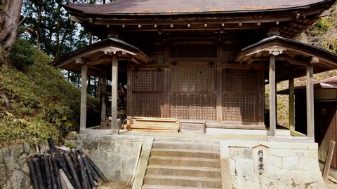 Koka, Shiga / Japan - 03 23 2019: Koka, Shiga Prefecture, Japan 23 March 2019- A slow motion jib shot of an Ancient Shinto Shrine at Hando Shrine in Shigaraki town