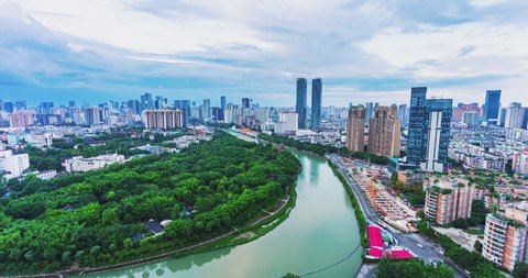 Time lapse cityscape of Chengdu city of Sichuan China in Cloudy day to night with busy traffic cars driving on the road  2019 wangjianglou park and jinjiang river