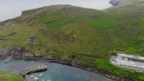 Drone footage above Boscastle, Cornwall showing the River Valency meeting the sea via the natural harbor.